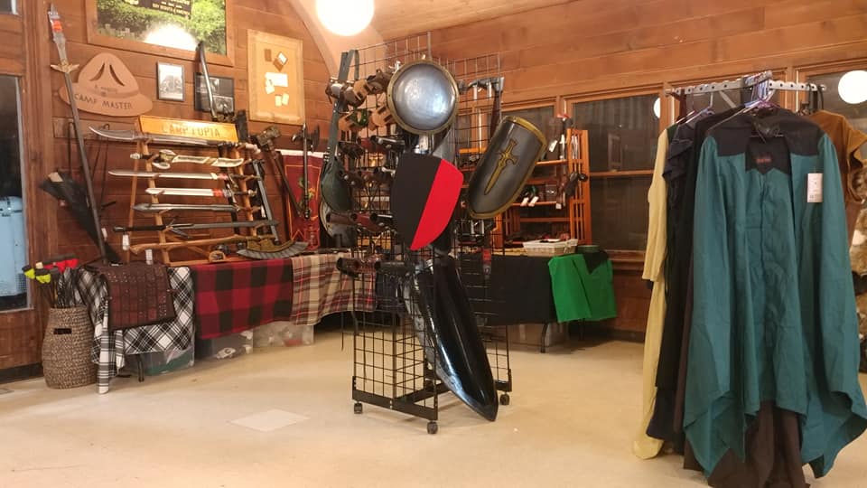 set at Gisido LARP with shields, cloaks, larp clothing, larp spears, swords, axe, armor, accessories, and more.